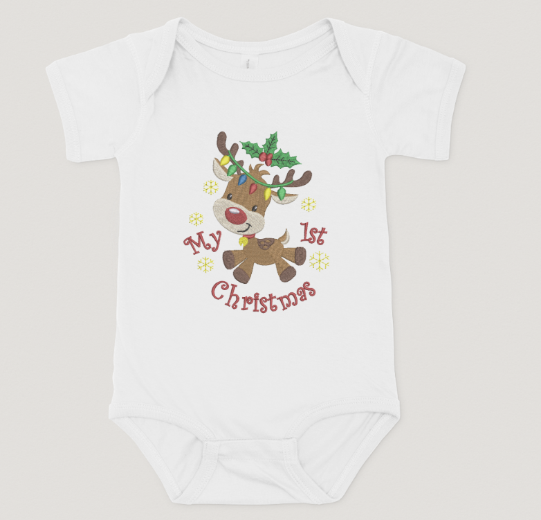 White baby onesie with a reindeer design and 'My 1st Christmas' text on a light gray background