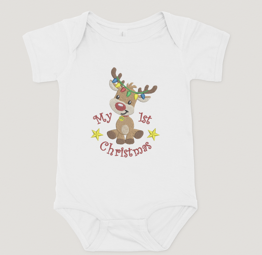 White baby onesie with a reindeer design and 'My 1st Christmas' text on a light gray background